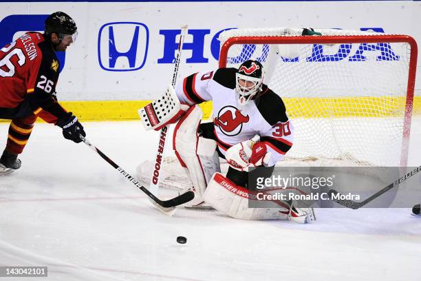Goaltender Martin Brodeur of the New Jersey Devils defends the net against Mikael Samuelsson of the Florida Panthers during Game Two of the Eastern...