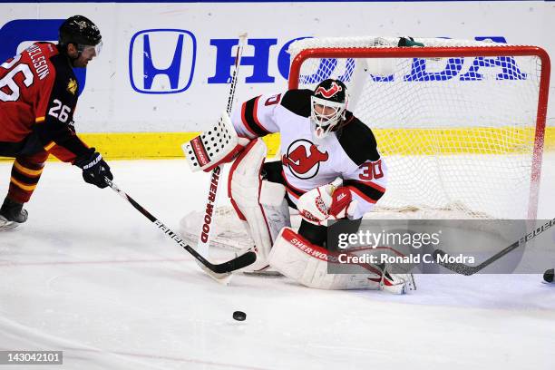 Goaltender Martin Brodeur of the New Jersey Devils defends the net against Mikael Samuelsson of the Florida Panthers during Game Two of the Eastern...