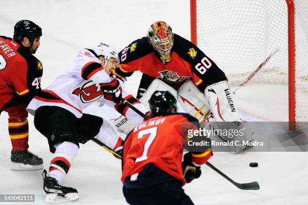 Jose Theodore of the Florida Panthers defends the net against Zach Parise New Jersey Devils during Game Two of the Eastern Conference Quarterfinals...