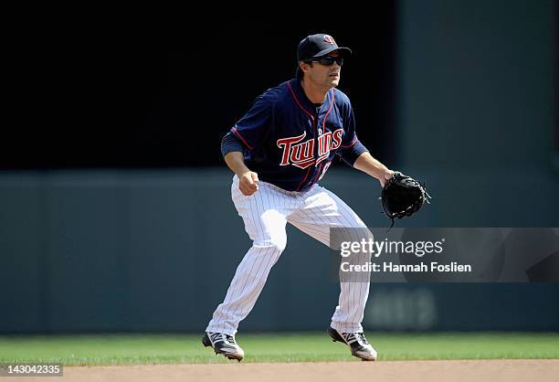 Jamey Carroll of the Minnesota Twins fields shortstop against the Los Angeles Angels of Anaheim on April 12, 2012 at Target Field in Minneapolis,...