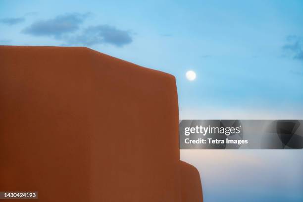 usa, new mexico, santa fe, adobe wall and moon on sky at sunset - adobe stock pictures, royalty-free photos & images