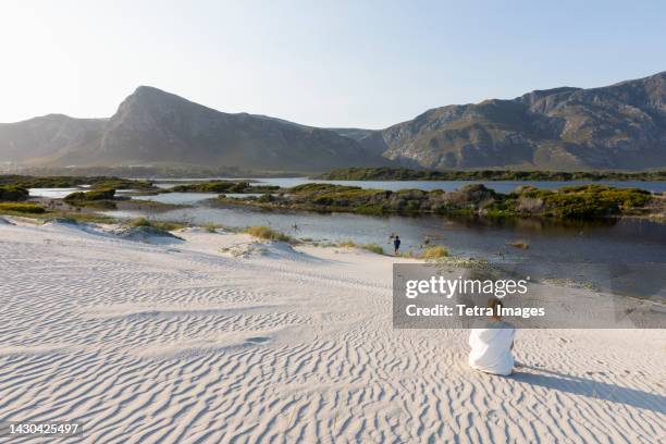 south africa, hermanus, boy (8-9) and girl (16-17) exploring grotto beach - hermanus stock-fotos und bilder