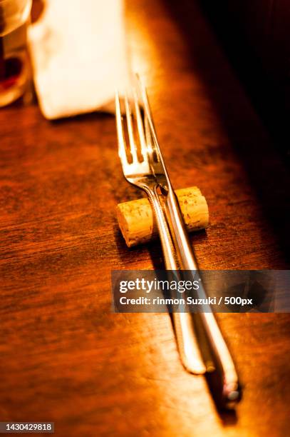 close-up of fork on table - フォーク stock-fotos und bilder