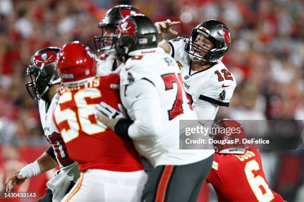 Tom Brady of the Tampa Bay Buccaneers looks to pass while under pressure against the Kansas City Chiefs during the second quarter at Raymond James...