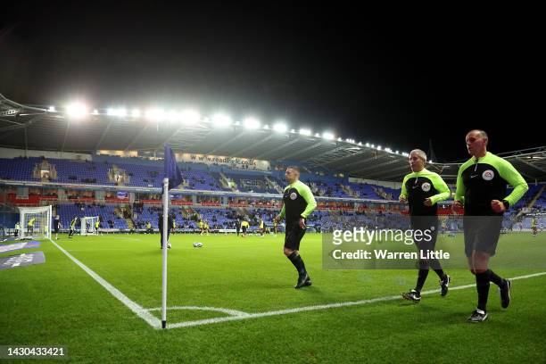 Referee Darren Bond , assistant referees Matthew Smith and Philip Dermott warm up prior to the Sky Bet Championship between Reading and Norwich City...