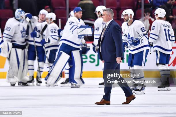 Head coach of the Toronto Maple Leafs, Sheldon Keefe, walks across the ice after a victory against the Montreal Canadiens in a preseason game at...