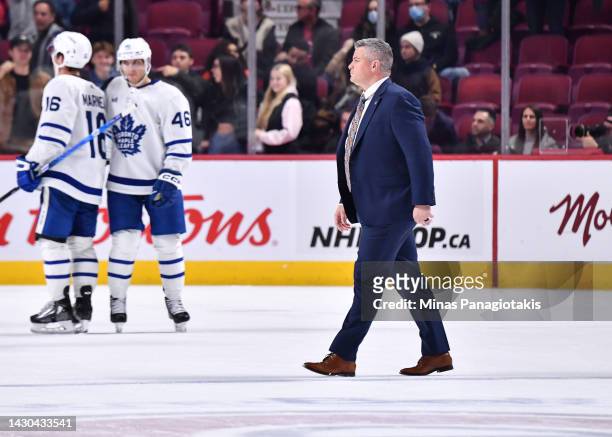 Head coach of the Toronto Maple Leafs, Sheldon Keefe, walks across the ice after a victory against the Montreal Canadiens in a preseason game at...