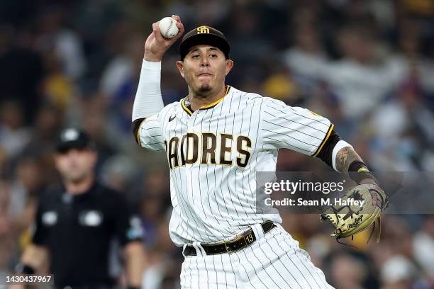 Manny Machado of the San Diego Padres throws to first base during a game against the Los Angeles Dodgers at PETCO Park on September 29, 2022 in San...