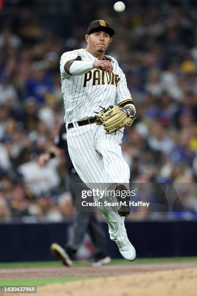 Manny Machado of the San Diego Padres throws to first base during a game against the Los Angeles Dodgers at PETCO Park on September 29, 2022 in San...