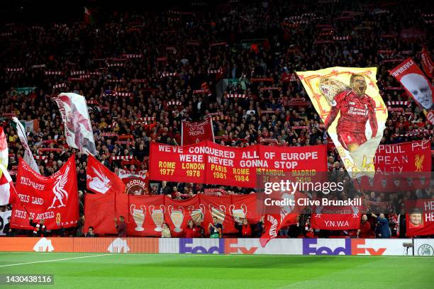 Liverpool fans show their support with flags and banners prior to the UEFA Champions League group A match between Liverpool FC and Rangers FC at...