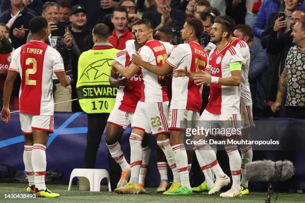 Mohammed Kudus of Ajax celebrates with teammates after scoring their team's first goal during the UEFA Champions League group A match between AFC...