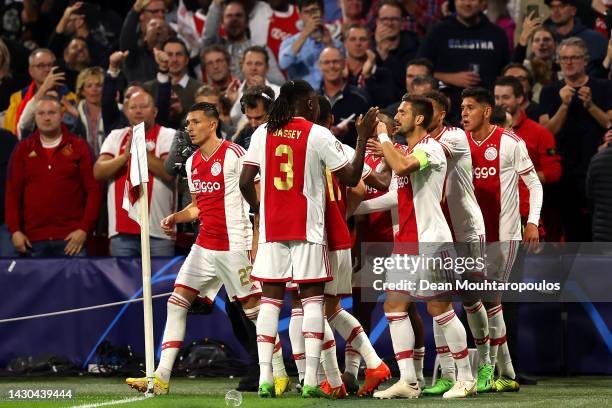 Mohammed Kudus of Ajax celebrates with teammates after scoring their team's first goal during the UEFA Champions League group A match between AFC...