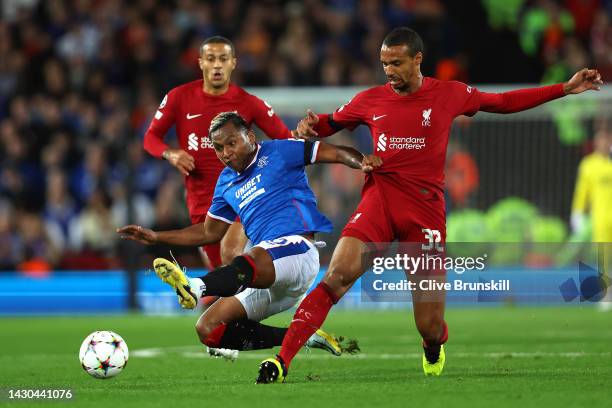 Alfredo Morelos of Rangers is challenged by Joel Matip and Thiago Alcantara of Liverpool during the UEFA Champions League group A match between...