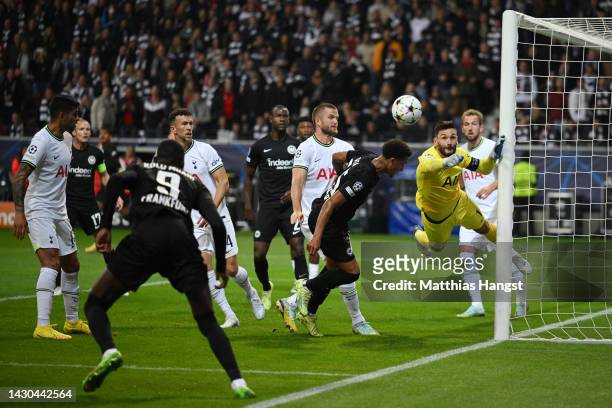 Ali Akman of Eintracht Frankfurt shoots as Hugo Lloris of Tottenham Hotspur makes a save during the UEFA Champions League group D match between...