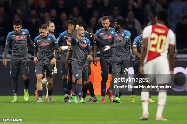 Giacomo Raspadori of SSC Napoli celebrates with teammates after scoring their team's first goal during the UEFA Champions League group A match...