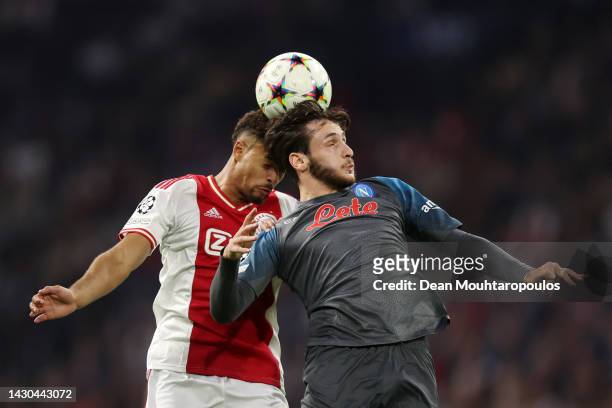 Khvicha Kvaratskhelia of SSC Napoli jumps for the ball with Devyne Rensch of Ajax during the UEFA Champions League group A match between AFC Ajax and...