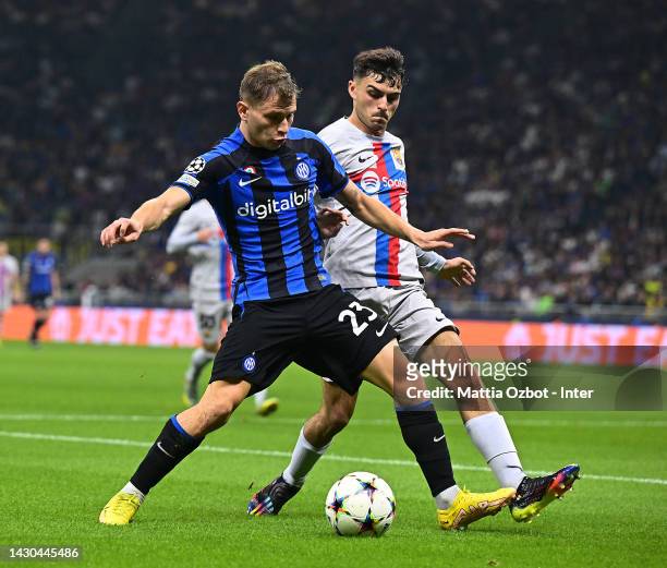 Nicolo Barella of FC Internazionale competes for the ball with Pedri of FC Barcelona during the UEFA Champions League group C match between FC...