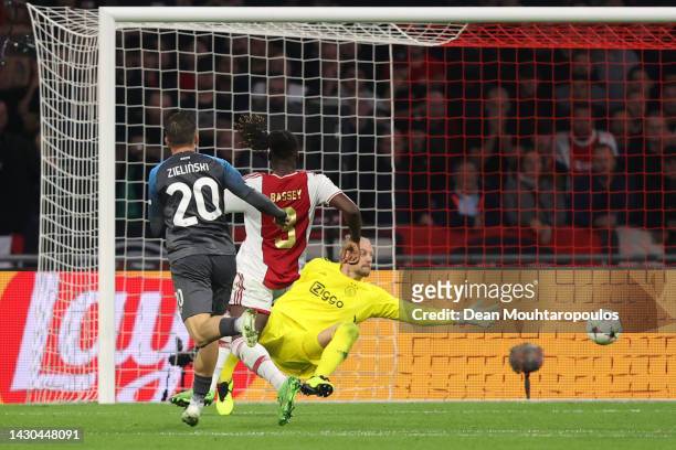 Piotr Zielinski of SSC Napoli scores their team's third goal past Remko Pasveer of Ajax during the UEFA Champions League group A match between AFC...