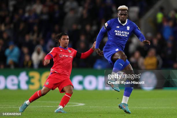 Tyrhys Dolan of Blackburn Rovers challenges Cedric Kipre of Cardiff City during the Sky Bet Championship between Cardiff City and Blackburn Rovers at...