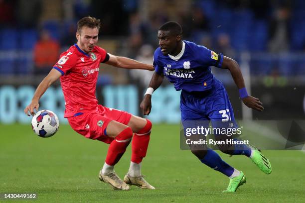 Ryan Hedges of Blackburn Rovers challenges Niels Nkounkou of Cardiff City during the Sky Bet Championship between Cardiff City and Blackburn Rovers...