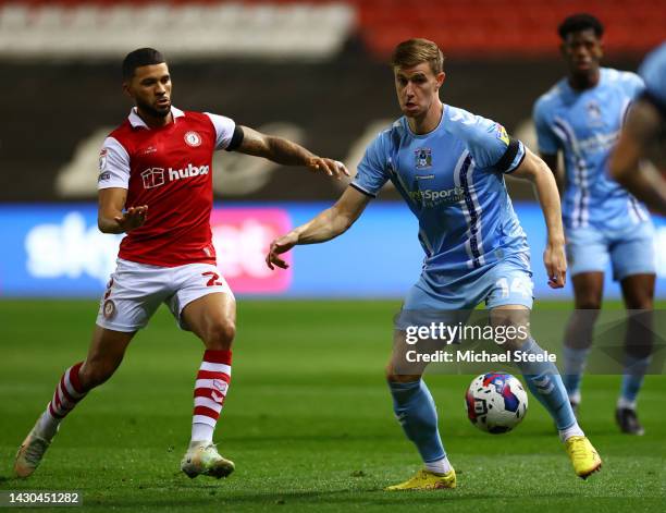 Ben Sheaf of Coventry City is challenged by Nahki Wells of Bristol City during the Sky Bet Championship match between Bristol City and Coventry City...