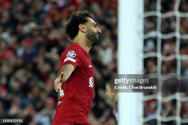 Mohamed Salah of Liverpool celebrates after scoring their team's second goal from the penalty spot during the UEFA Champions League group A match...