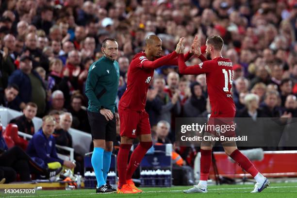 Jordan Henderson is replaced by Fabinho of Liverpool during the UEFA Champions League group A match between Liverpool FC and Rangers FC at Anfield on...