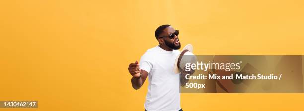 young black man top dancing isolated on a yellow background - rapper isolated stock pictures, royalty-free photos & images