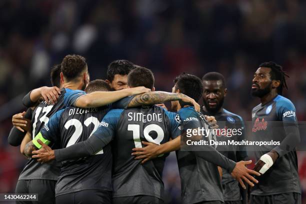 Giovanni Simeone of SSC Napoli celebrates with teammates after scoring their team's sixth goal during the UEFA Champions League group A match between...