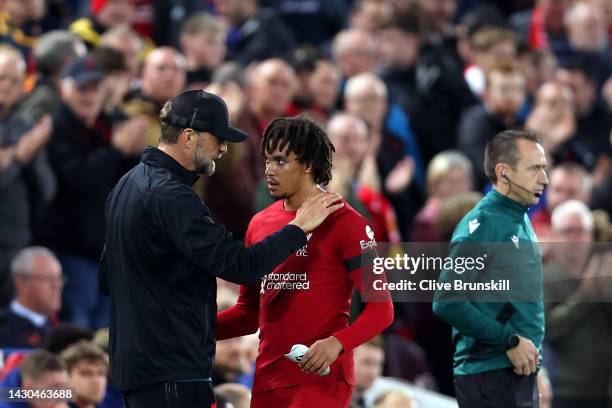 Juergen Klopp embraces Trent Alexander-Arnold of Liverpool after they are substituted off during the UEFA Champions League group A match between...