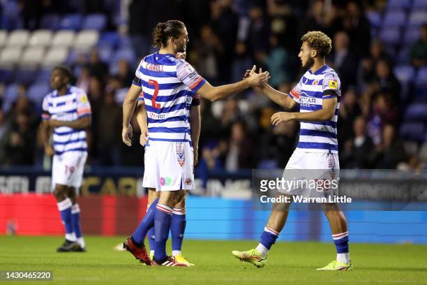 Andy Carroll of Reading shakes hands with teammate Nesta Guinness-Walker following their side's draw in the Sky Bet Championship between Reading and...