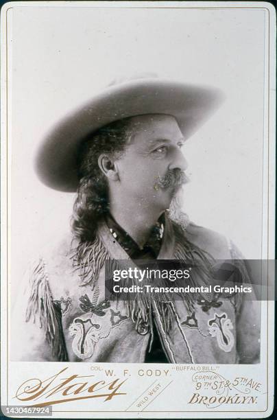 Cabinet photo of American showman Buffalo Bill Cody , dressed in costume for his Wild West Show, as he poses in a studio, New York, New York, circa...