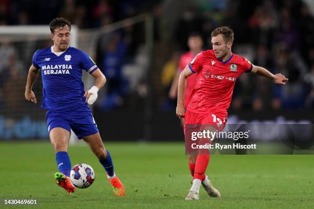 Ryan Wintle of Cardiff City marks Ryan Hedges of Blackburn Rovers during the Sky Bet Championship between Cardiff City and Blackburn Rovers at...