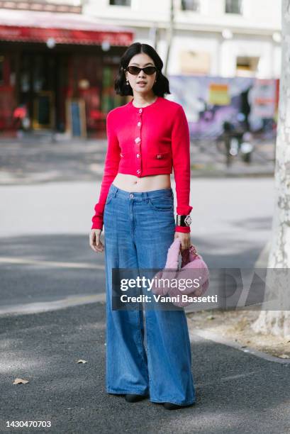 Guest poses with a Chanel pink furry bag after the Chanel show during Paris Fashion Week - Womenswear Spring/Summer 2023 on October 04, 2022 in...