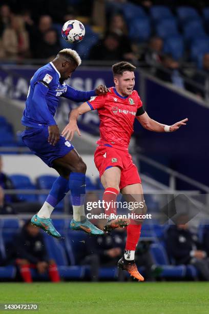 Cedric Kipre of Cardiff City contends for the aerial ball with George Hirst of Blackburn Rovers during the Sky Bet Championship between Cardiff City...