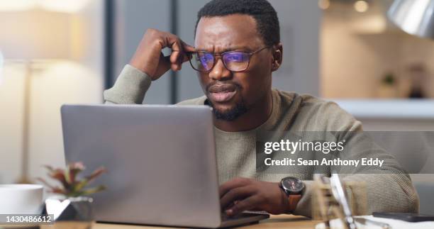 anxiety, stress and confused man on a laptop in home office, worry and anxious about an online project deadline. glitch, 404 and system error delay with black business man working remote, frustrated - förvirring bildbanksfoton och bilder