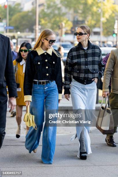 Alexandra Carl wears denim jeans, cropped blazer with yellow collar & cuffs bag & Pernille Teisbaek wears denim skirt, checkered black jacket wears...