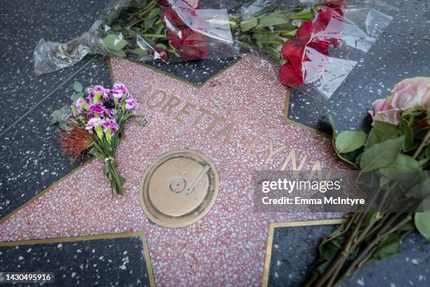 Flowers are placed on Loretta Lynn's star on the Hollywood walk of fame on October 04, 2022 in Los Angeles, California. Lynn passed away at her home...