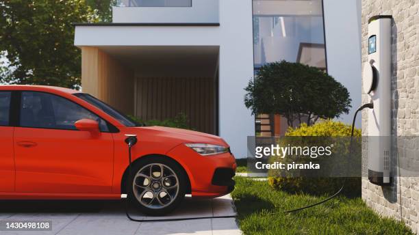 electric vehicle charging - red car wire stock pictures, royalty-free photos & images