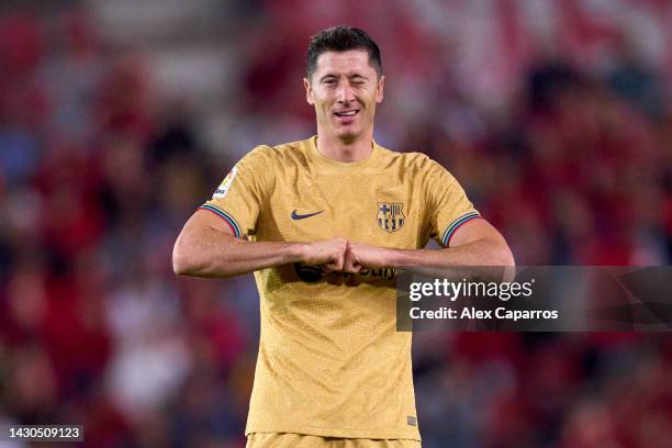 Robert Lewandowski of FC Barcelona celebrates after scoring his team's first goal during the LaLiga Santander match between RCD Mallorca and FC...