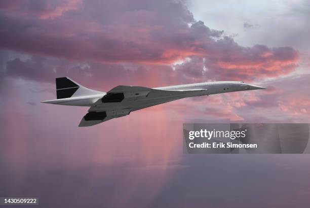 inflight view of a british aerospace concorde sst (supersonic transport) banking into a dramatic sunset sky - överljudsplan bildbanksfoton och bilder