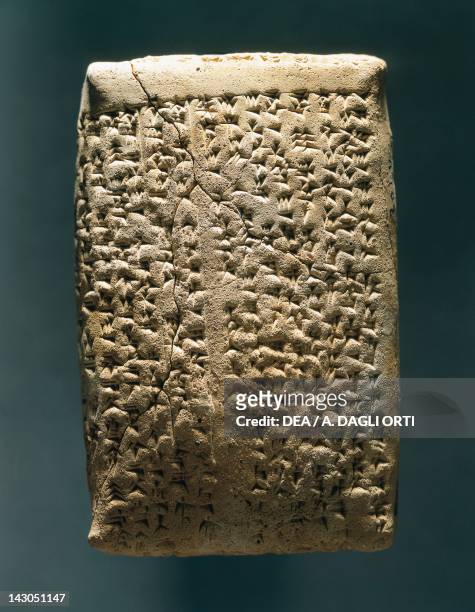 Clay tablet inscribed in cuneiform with a contract of sale of children. Artefact from Syria. Assyrian civilisation, 13th Century BC. Aleppo,...