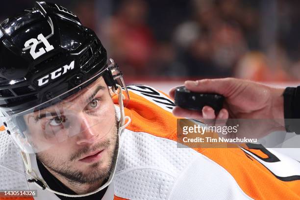 Scott Laughton of the Philadelphia Flyers watches the puck during the second period against the New York Islanders at Wells Fargo Center on October...