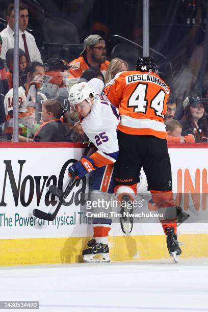 Sebastian Aho of the New York Islanders and Nicolas Deslauriers of the Philadelphia Flyers collide during the second period at Wells Fargo Center on...