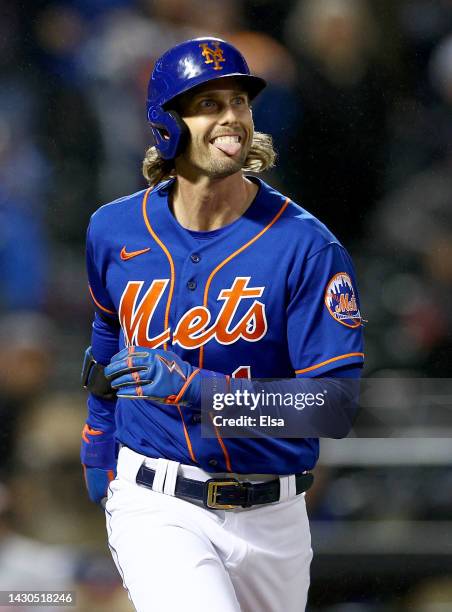 Jeff McNeil of the New York Mets reacts after he hit a solo home run in the first inning against the Washington Nationals during game two of a double...