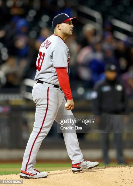 Paolo Espino of the Washington Nationals reacts after giving up a solo home run to Jeff McNeil of the New York Mets in the first inning during game...