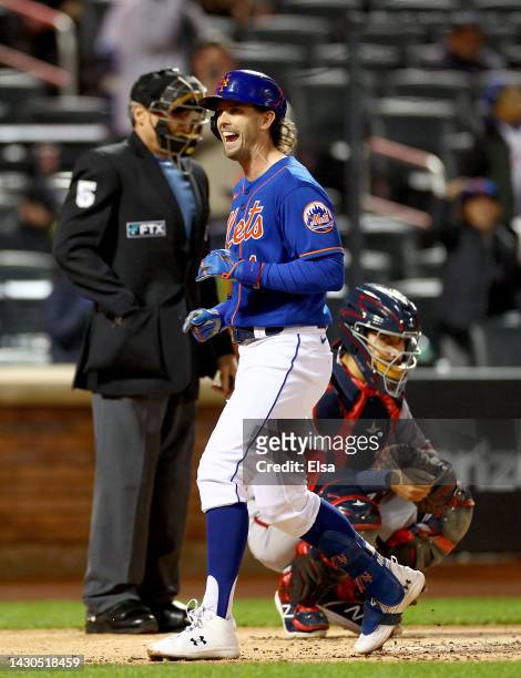 Jeff McNeil of the New York Mets celebrates his solo home run as catcher Tres Barrera of the Washington Nationals reacts in the first inning during...