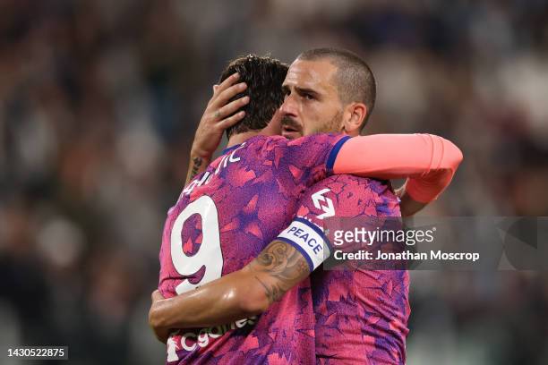 Dusan Vlahovic of Juventus celebrates with team mate Leonardo Bonucci after scoring to give the side a 2-0 lead during the Serie A match between...