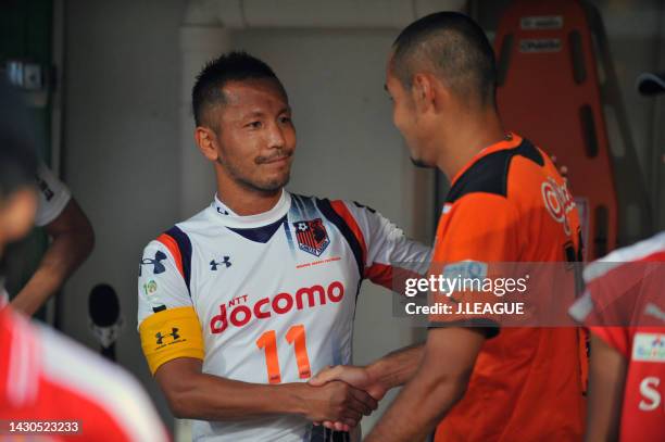 Chikara Fujimoto of Omiya Ardija and Naohiro Takahara of Shimizu S-Pulse shake hands prior to the J.League J1 match between Shimizu S-Pulse and Omiya...