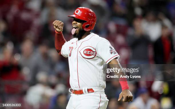 Chuckie Robinson of the Cincinnati Reds celebrates after hitting a two run home run in the 7th inning against the Chicago Cubs at Great American Ball...